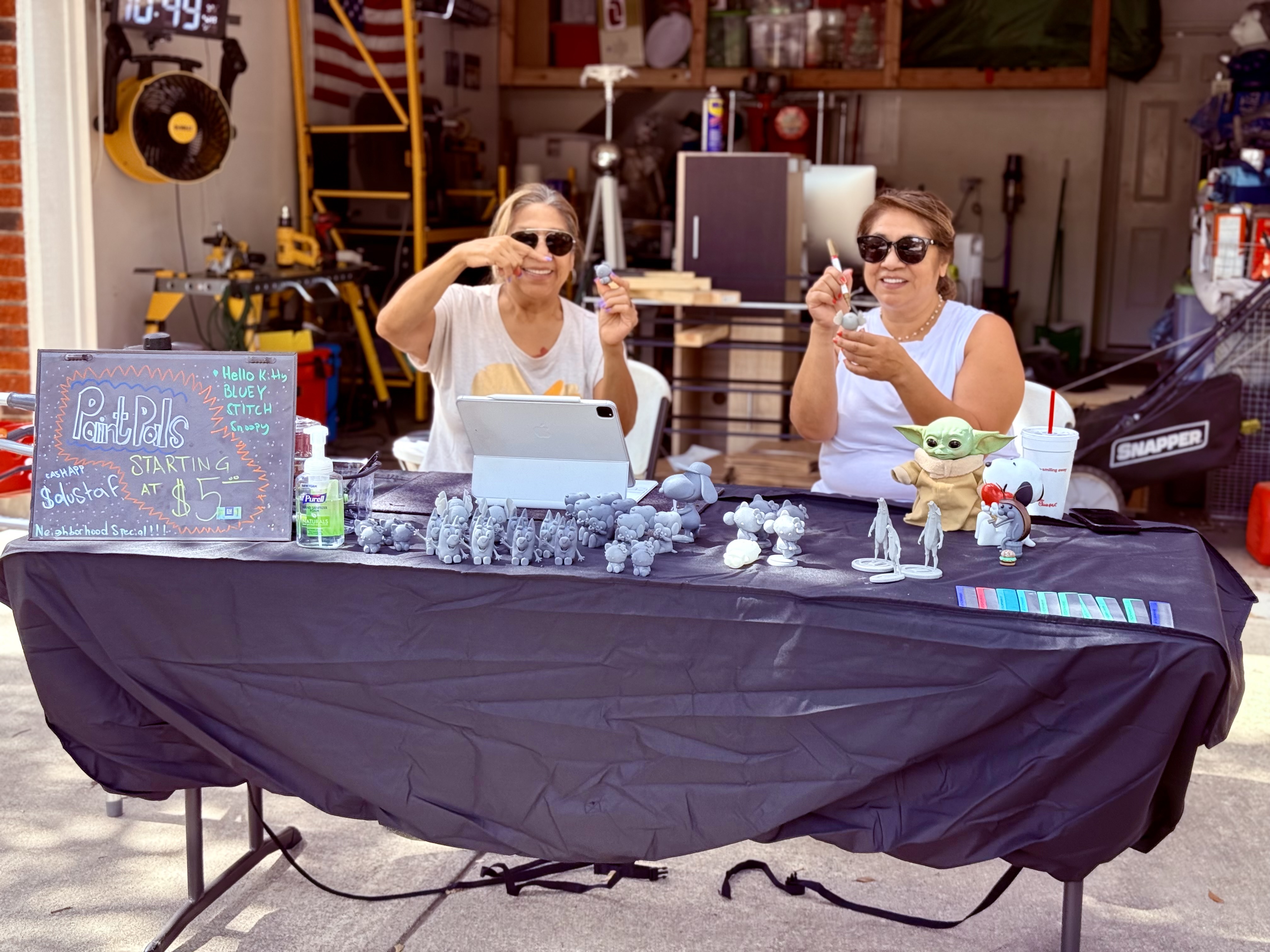The Print Gals - Two Texas sisters behind Dusty's Magic, showing off their Paint Pals at a local market